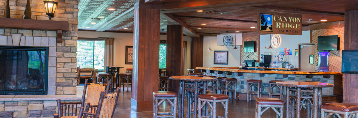 Canyon Ridge Taproom banner image showing seating area and bar.