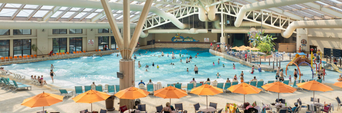 Banner image of Wild Waterdome Indoor Waterpark with the Great Wave indoor wave pool in background.