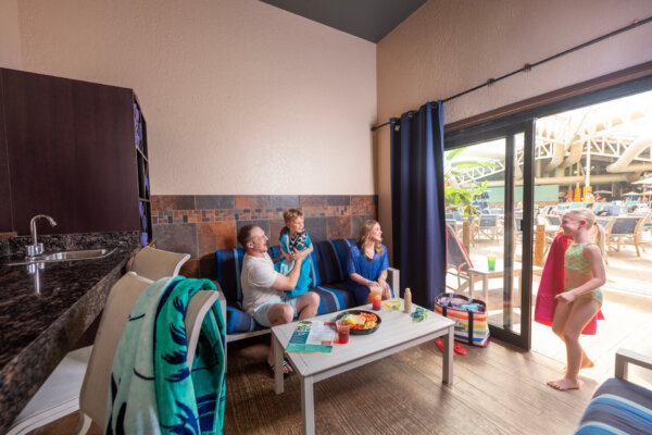 Family sitting inside their cabana in the Wild WaterDome