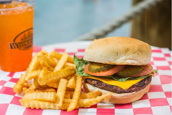 cheeseburger with french fries basket with a drink