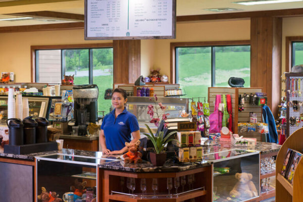 campside coffee and gifts. girl working at the retail counter