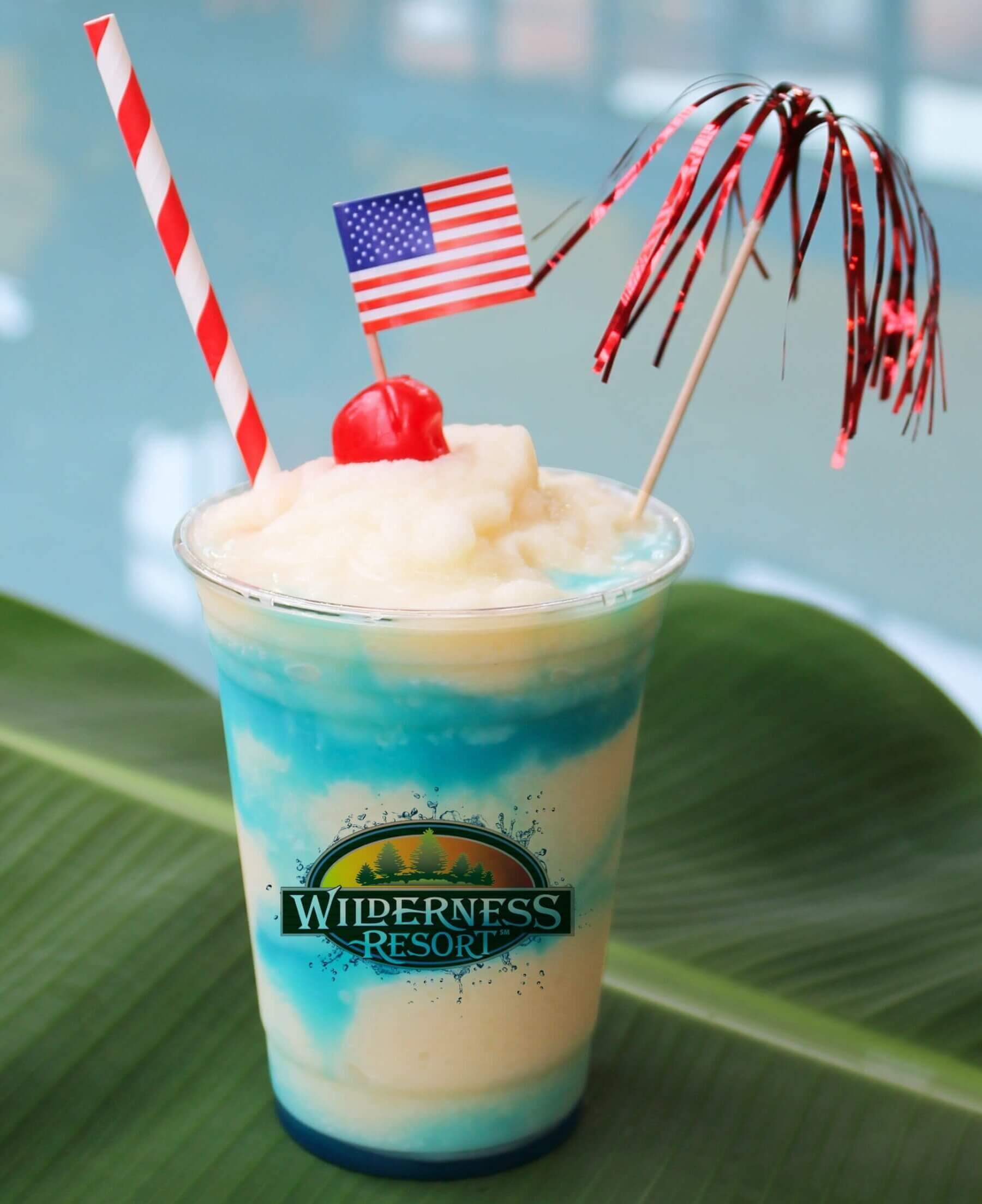 2026 Drink of Summer - AmeriColada. Meet your new summer favorite. The AmeriColada blends frozen coconut rum piña colada with a splash of blue curaçao for a bold, beachy vibe, topped off with a cherry for the perfect finishing touch.