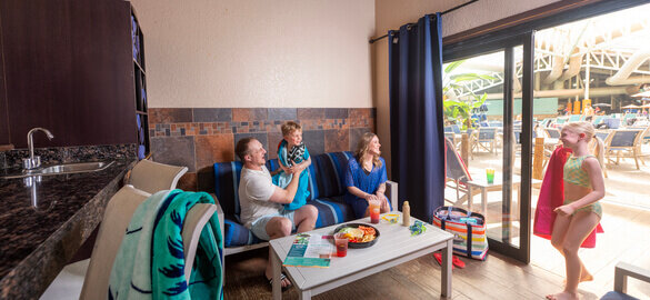 Family sitting inside their cabana in the Wild WaterDome