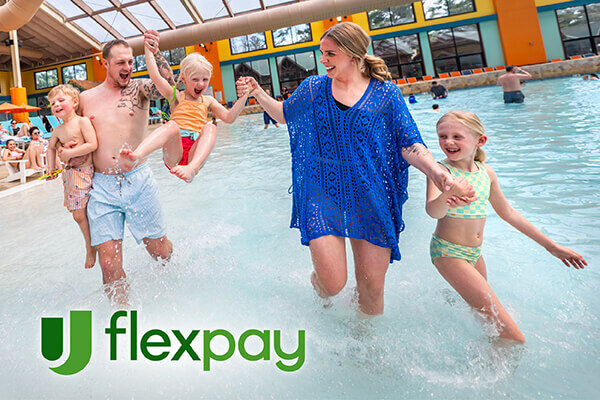 Family playing in an indoor pool with a logo for Flex Pay in the corner.